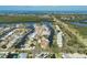 Amazing aerial view of waterfront homes with boat docks, beautiful landscape, and a road nearby at 10304 Sandpiper W Rd, Bradenton, FL 34209