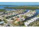 Stunning aerial view of waterfront homes with private docks and lush landscaping in a coastal community, Tampa Bay, Florida at 10304 Sandpiper W Rd, Bradenton, FL 34209