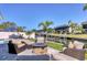 Waterfront home features an outdoor lounge area with fire pit and canal view at 10304 Sandpiper W Rd, Bradenton, FL 34209