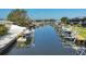 Picturesque canal with boats docked, offering waterfront living in a serene neighborhood at 10304 Sandpiper W Rd, Bradenton, FL 34209
