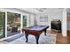 Billiard table in a relaxing game room, next to the outdoor seating area by the canal at 10304 Sandpiper W Rd, Bradenton, FL 34209