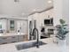 Contemporary kitchen featuring an undermount sink, stainless steel appliances, and an open layout to the living area at 10304 Sandpiper W Rd, Bradenton, FL 34209