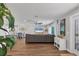 Open-concept living area with wood floors and lots of natural light at 10304 Sandpiper W Rd, Bradenton, FL 34209
