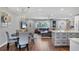 Bright open floor plan featuring eat in kitchen, stainless appliances, island, and living space with luxury finishes at 10304 Sandpiper W Rd, Bradenton, FL 34209