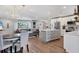 Bright open floor plan featuring eat in kitchen, stainless appliances, island, and living space with luxury finishes at 10304 Sandpiper W Rd, Bradenton, FL 34209