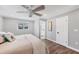 Bright, airy bedroom featuring a ceiling fan, and en suite bathroom with great natural light at 10304 Sandpiper W Rd, Bradenton, FL 34209