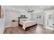 Spacious main bedroom with ample natural light, ceiling fan, and ensuite bathroom at 10304 Sandpiper W Rd, Bradenton, FL 34209