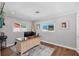 Bright home office with desk, wood floors and two bright windows at 10304 Sandpiper W Rd, Bradenton, FL 34209