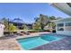 Private pool with lounge chairs and patio is perfect for backyard gatherings with a canal view at 10304 Sandpiper W Rd, Bradenton, FL 34209