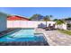 Inviting pool with lounge chairs and a privacy fence is perfect for relaxation and backyard enjoyment at 10304 Sandpiper W Rd, Bradenton, FL 34209