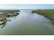 Breathtaking waterfront featuring lush trees, ocean view, channel markers, and waterfront properties at 10304 Sandpiper W Rd, Bradenton, FL 34209