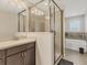 Modern bathroom featuring a glass-enclosed shower and soaking tub for a spa-like experience at 11925 Brookside Dr, Bradenton, FL 34211