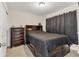 Bedroom featuring a large bed with storage underneath, as well as a matching dresser at 11925 Brookside Dr, Bradenton, FL 34211