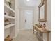 Stylish entryway with a decorative table, neutral walls, and elegant tile flooring at 11925 Brookside Dr, Bradenton, FL 34211