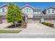 Inviting townhome with a two-car garage, stone accents, and well-maintained landscaping at 11925 Brookside Dr, Bradenton, FL 34211