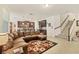 Open-concept living area featuring tile floors, a spacious layout, and access to the kitchen at 11925 Brookside Dr, Bradenton, FL 34211