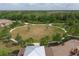 Community open field with walking paths and green space for recreation and relaxation at 11925 Brookside Dr, Bradenton, FL 34211