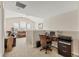 Bright, loft sitting area with home office and seating arrangement featuring a tan leather couch at 11925 Brookside Dr, Bradenton, FL 34211