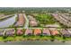 A high-angle aerial shot showcasing a residential neighborhood and waterfront views at 12020 Legacy Estates Blvd, Sarasota, FL 34238
