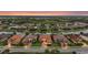 Aerial view of a luxury community with waterfront homes, manicured lawns and mature trees at 12020 Legacy Estates Blvd, Sarasota, FL 34238