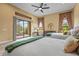 Bedroom with two beds has large windows, a sliding glass door, and views of the backyard at 12020 Legacy Estates Blvd, Sarasota, FL 34238