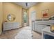 bedroom with large windows and white furniture, including a desk and storage drawers at 12020 Legacy Estates Blvd, Sarasota, FL 34238
