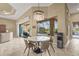 Dining area with table and view of pool through large screened windows at 12020 Legacy Estates Blvd, Sarasota, FL 34238