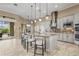 Spacious kitchen featuring a large island with bar seating and pendant lighting at 12020 Legacy Estates Blvd, Sarasota, FL 34238