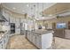 Open kitchen featuring stainless steel appliances, tiled backsplash and island with bar seating at 12020 Legacy Estates Blvd, Sarasota, FL 34238