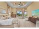 Main bedroom with large window overlooking the lawn and tray ceiling at 12020 Legacy Estates Blvd, Sarasota, FL 34238