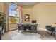 Office with desk and chair, view of landscaped yard through large arched window at 12020 Legacy Estates Blvd, Sarasota, FL 34238