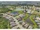 An aerial view of homes surrounding multiple beautiful ponds in a well-manicured community at 12210 Goldenrod Ave, Bradenton, FL 34212