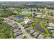 An aerial view with a locator pin of homes surrounding multiple ponds in a well-manicured community at 12210 Goldenrod Ave, Bradenton, FL 34212
