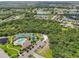 An aerial view of a neighborhood featuring a community center, pool, playground and tennis courts at 12210 Goldenrod Ave, Bradenton, FL 34212