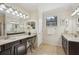 Elegant bathroom featuring double vanities, a makeup counter, and a bright window at 12210 Goldenrod Ave, Bradenton, FL 34212