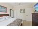 Comfortable bedroom with large dresser, closet, and bright natural light at 12210 Goldenrod Ave, Bradenton, FL 34212