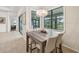 Dining area with modern table, comfortable chairs, and view of backyard at 12210 Goldenrod Ave, Bradenton, FL 34212