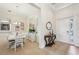 Bright dining room with a white table, stylish chairs, and decorative mirror at 12210 Goldenrod Ave, Bradenton, FL 34212