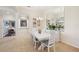 Bright dining room with a white table, stylish chairs, and decorative mirror at 12210 Goldenrod Ave, Bradenton, FL 34212