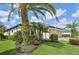 Exterior showcasing landscaping with palm trees surrounding the property at 12210 Goldenrod Ave, Bradenton, FL 34212