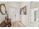 Inviting foyer with tile flooring, white door, and attractive decor at 12210 Goldenrod Ave, Bradenton, FL 34212