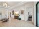 Spacious living room with tile floors, large TV, and elegant decor at 12210 Goldenrod Ave, Bradenton, FL 34212