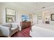 Main bedroom features a large window, TV and hardwood floors at 12210 Goldenrod Ave, Bradenton, FL 34212