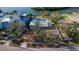 Charming waterfront property featuring a private pool, lush landscaping, and a serene setting surrounded by mature trees and manicured grounds at 1479 Bay Point Dr, Sarasota, FL 34236