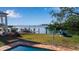 Enjoy bay view from backyard with pool and dock, perfect for outdoor living and entertaining at 1479 Bay Point Dr, Sarasota, FL 34236
