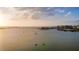 Stunning water view featuring boats, a bridge, and cityscape, offering a picturesque waterfront lifestyle at 1479 Bay Point Dr, Sarasota, FL 34236
