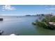 Beautiful waterfront view capturing bay, skyline, and bridge in background at 1479 Bay Point Dr, Sarasota, FL 34236