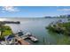 Waterfront property with a dock and scenic views of the water and bridge at 1479 Bay Point Dr, Sarasota, FL 34236