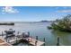 Waterfront property with boat docks and views of the city skyline and a bridge in the background at 1479 Bay Point Dr, Sarasota, FL 34236