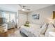 Charming bedroom with coastal decor, a ceiling fan, and a comfortable bed with a turtle plush at 1490 Mahogany Ln # 706, Palm Harbor, FL 34683